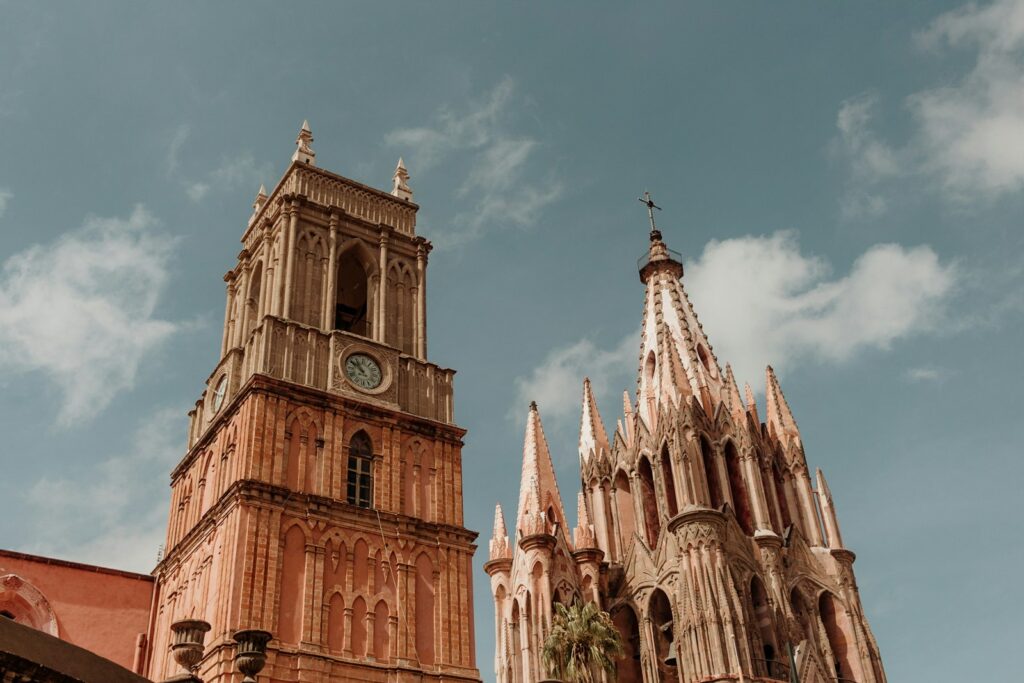 a large cathedral with a clock on it's side