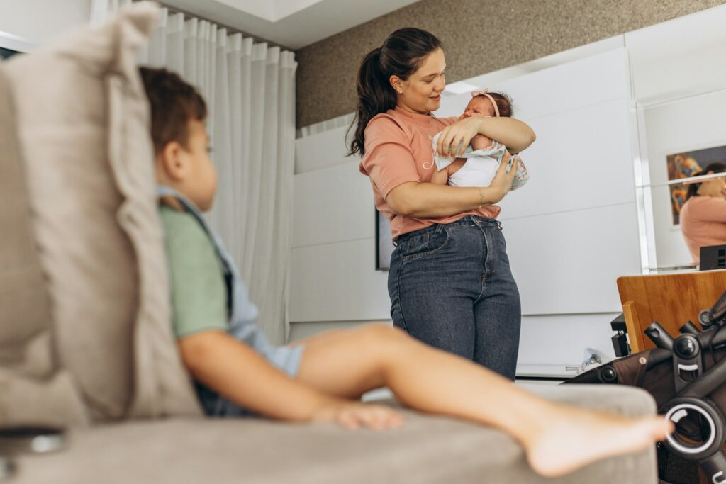 a woman holding a baby in her arms