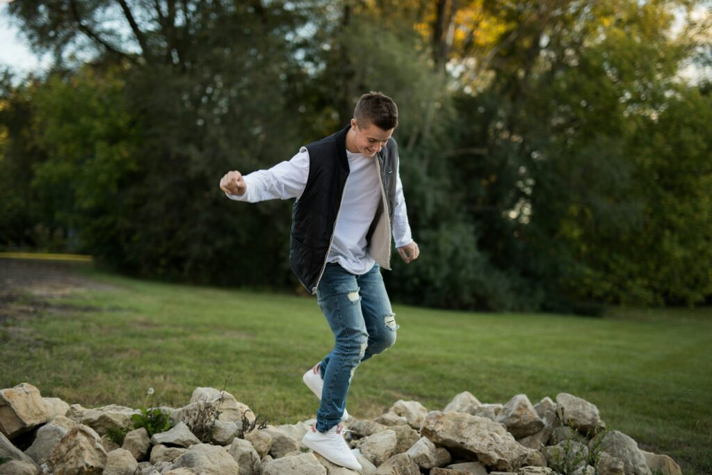 man standing on stones