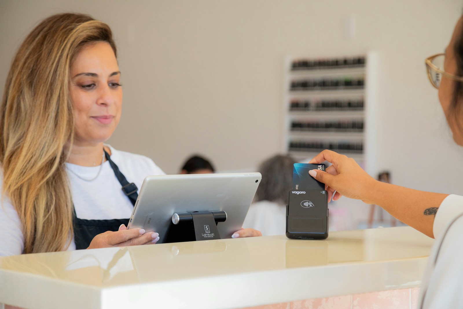 A woman is making a card payment.
