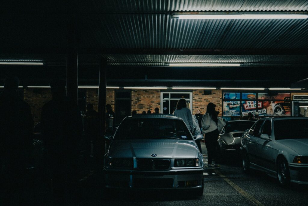 A group of cars parked in a parking garage