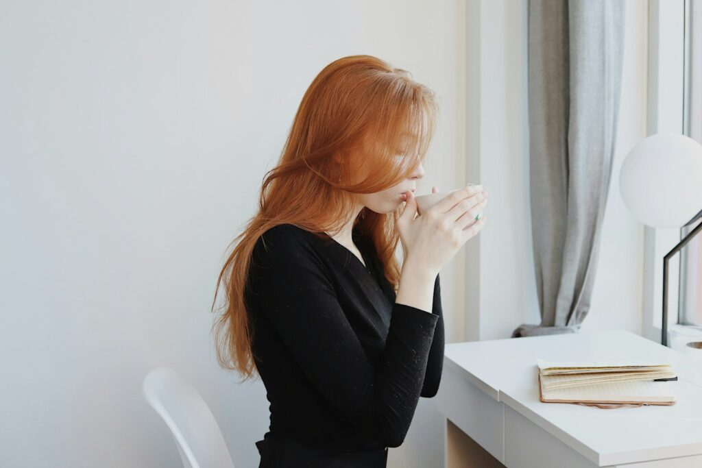 woman in black long sleeve shirt sitting on chair