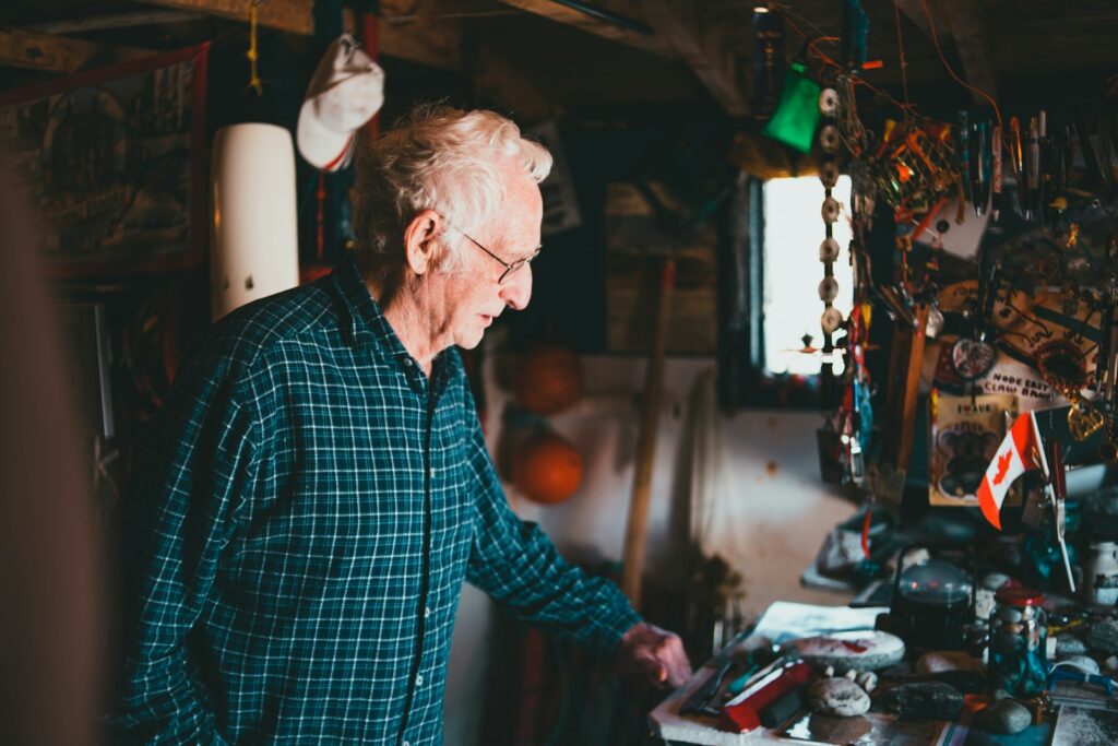 a man standing in front of a table filled with assorted items