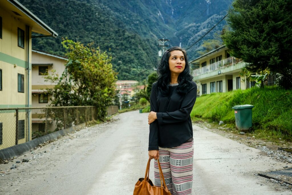 woman carrying brown bag