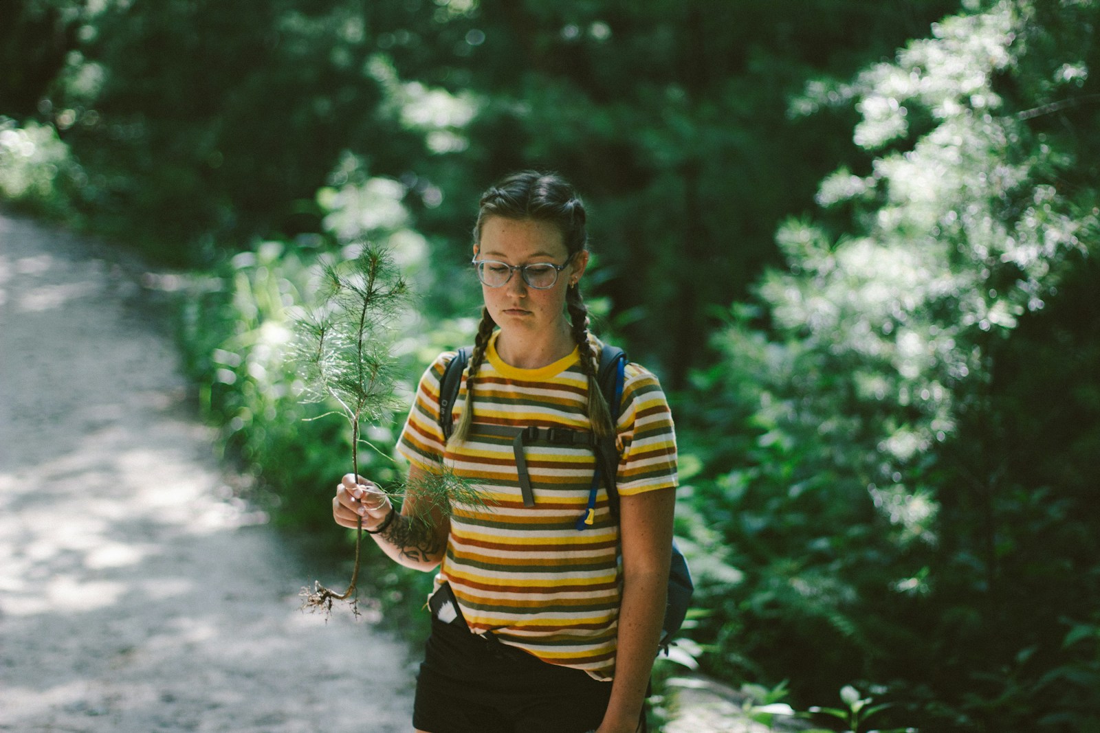woman wearing white and gray striped crew-neck T-shirt
