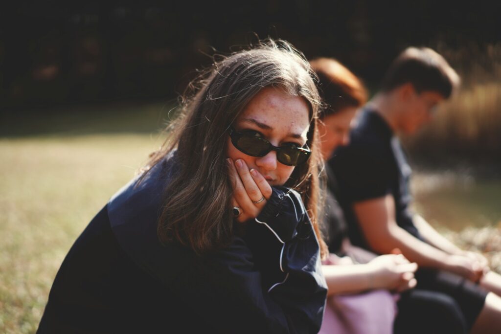 woman in black and white shirt wearing black sunglasses