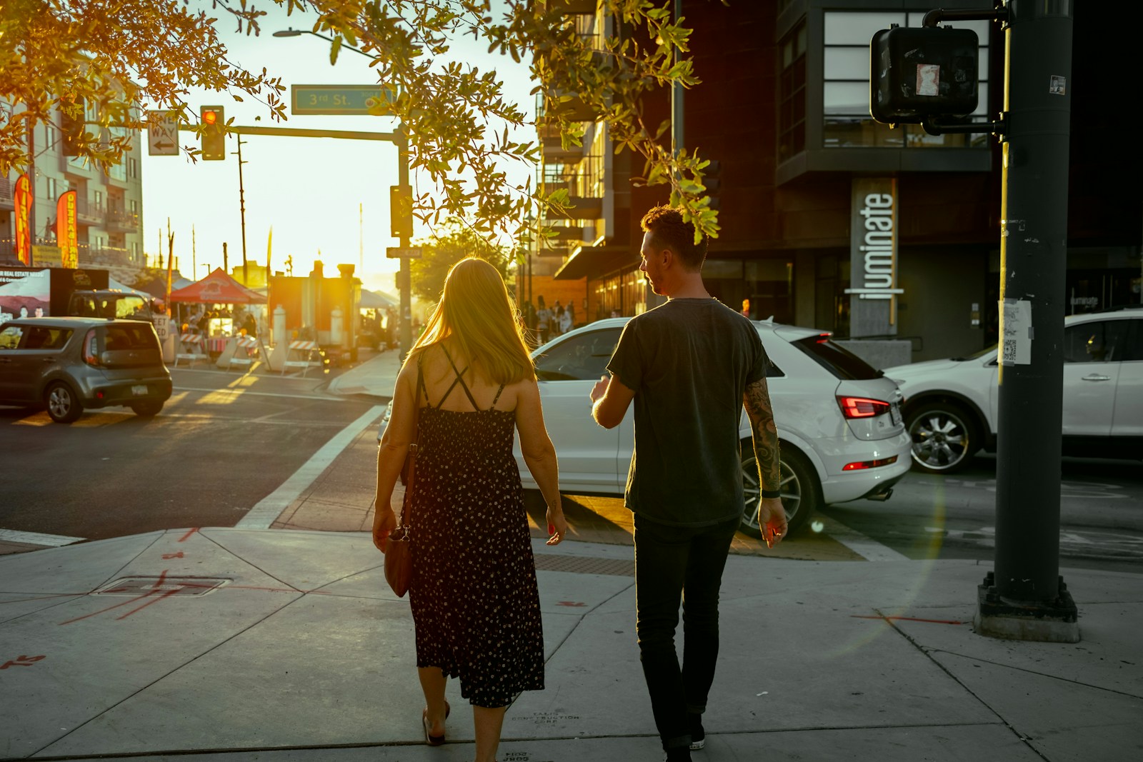 a man and a woman walking down a street