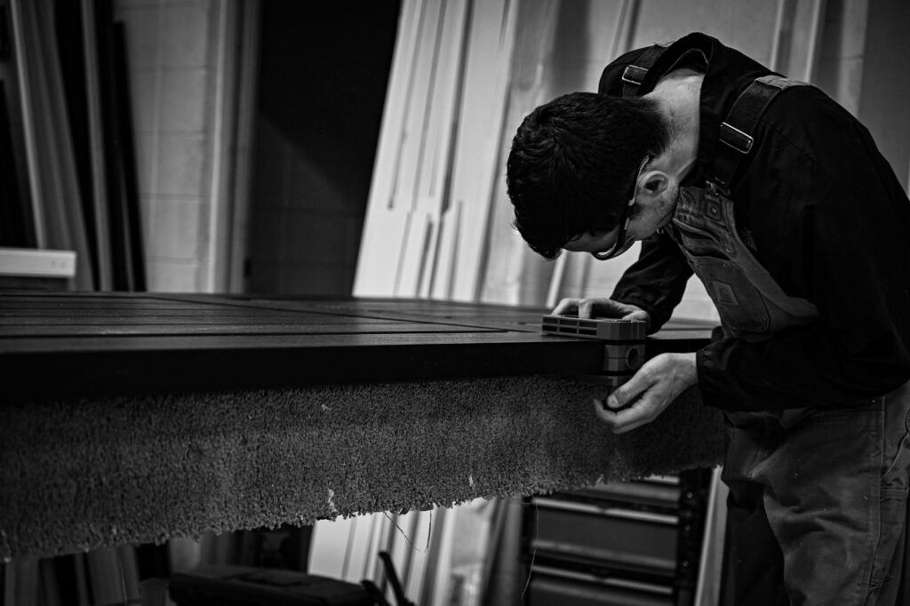 a man is leaning over a table and looking at something
