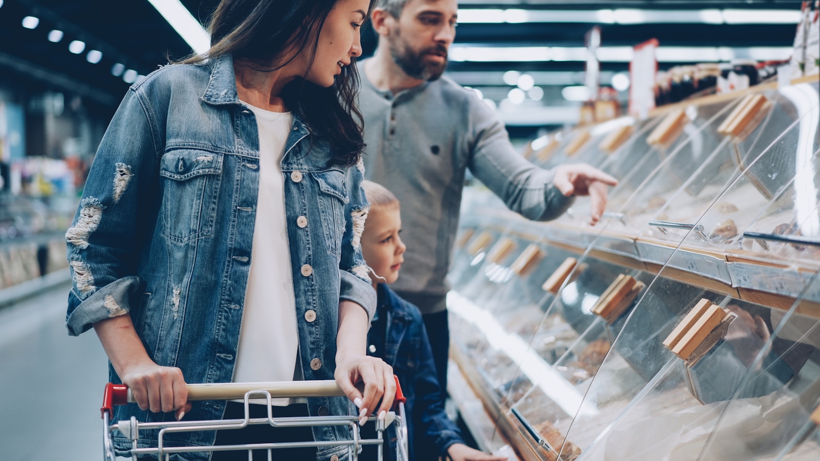 A family is shopping in a grocery store.