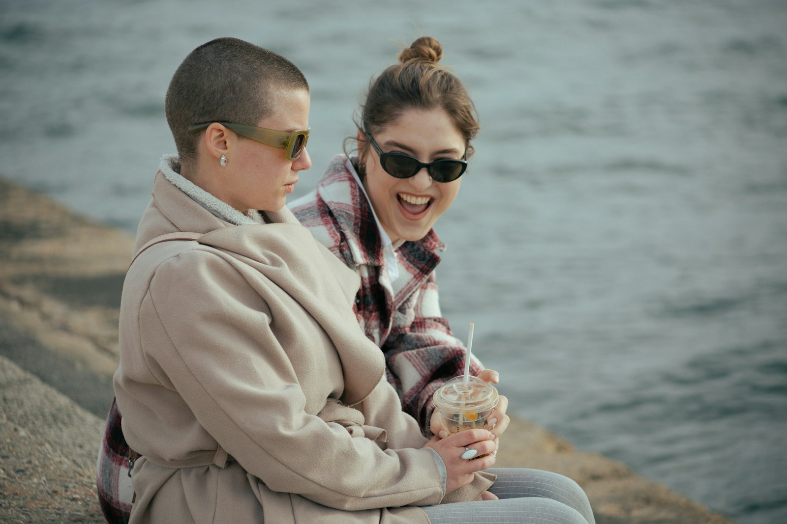 a couple of women sitting next to each other
