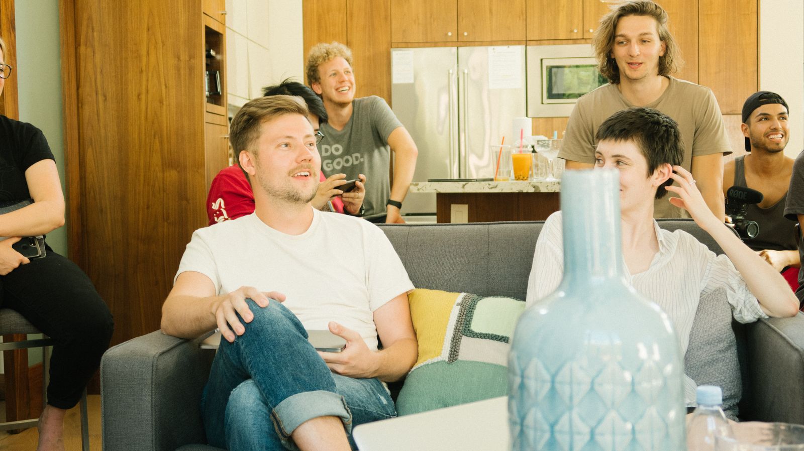 A diverse group of friends enjoying quality time together in a modern living room.