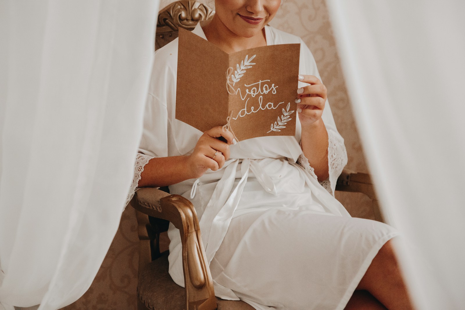 girl in white dress holding brown wooden board