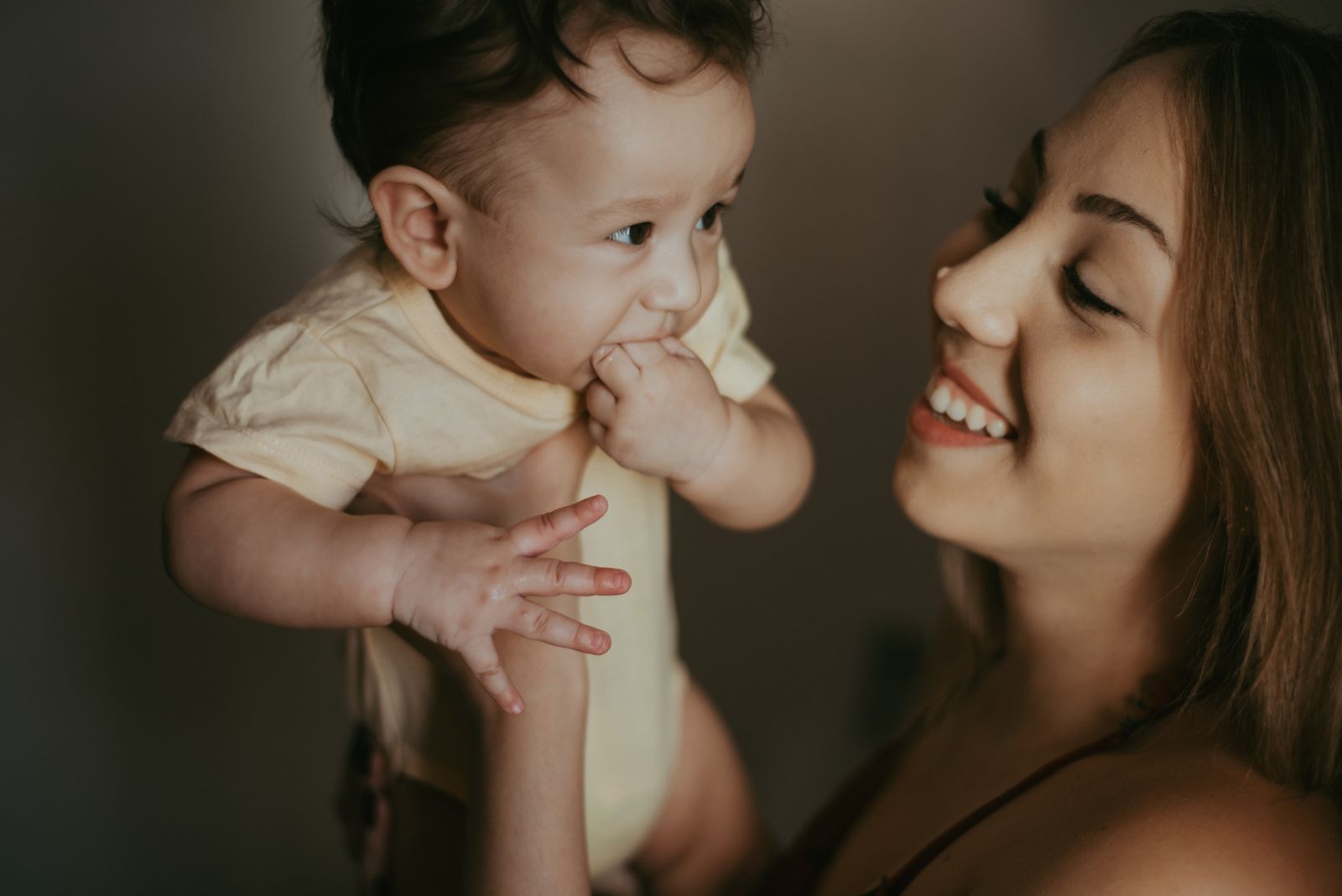 A heartwarming portrait of a mother holding her baby close, capturing the essence of love and togetherness.