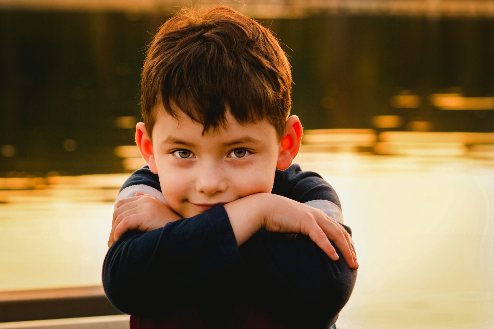 a young boy is posing for a picture