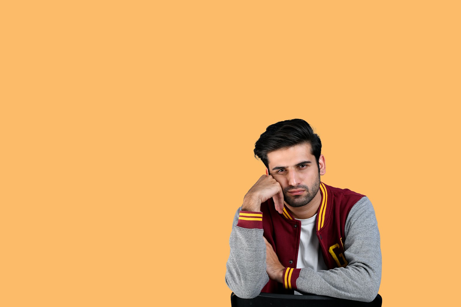 a man with his hand on his face