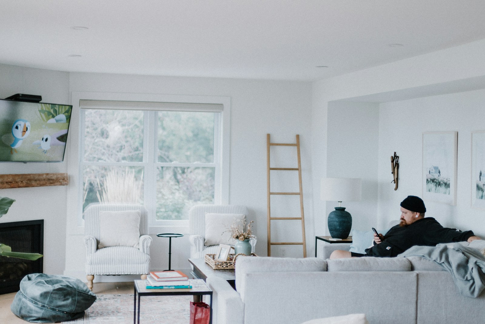 A man sitting on a couch in a living room