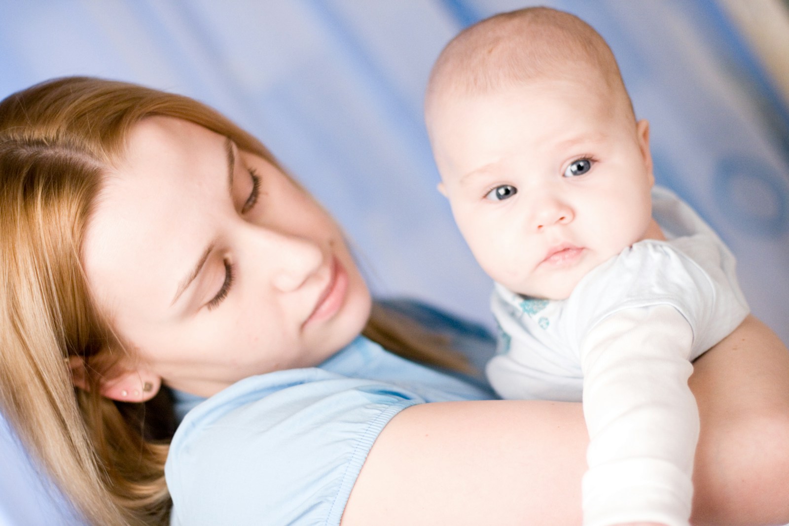 A woman holding a baby in her arms