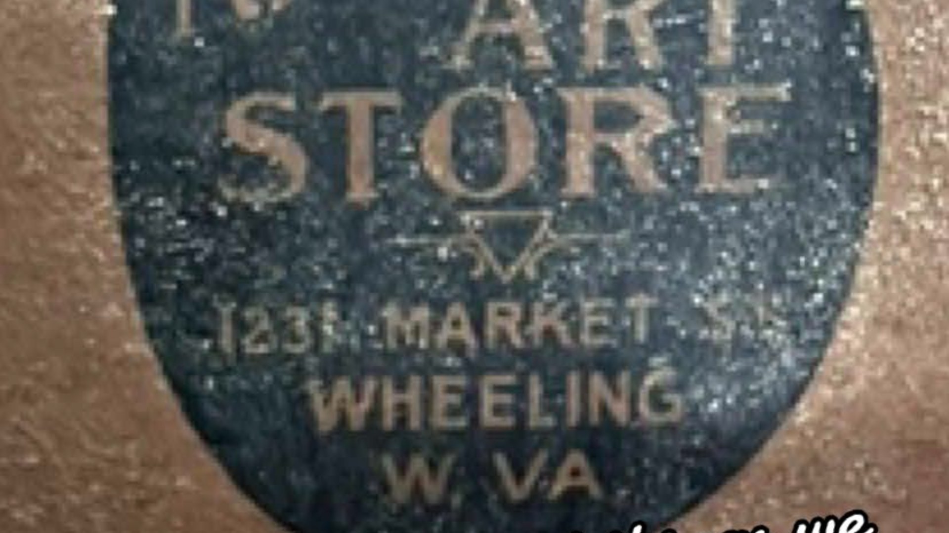 Close-up of an antique Art Store label from Market Street in Wheeling, West Virginia, found during the renovation of an 1858 Victorian house