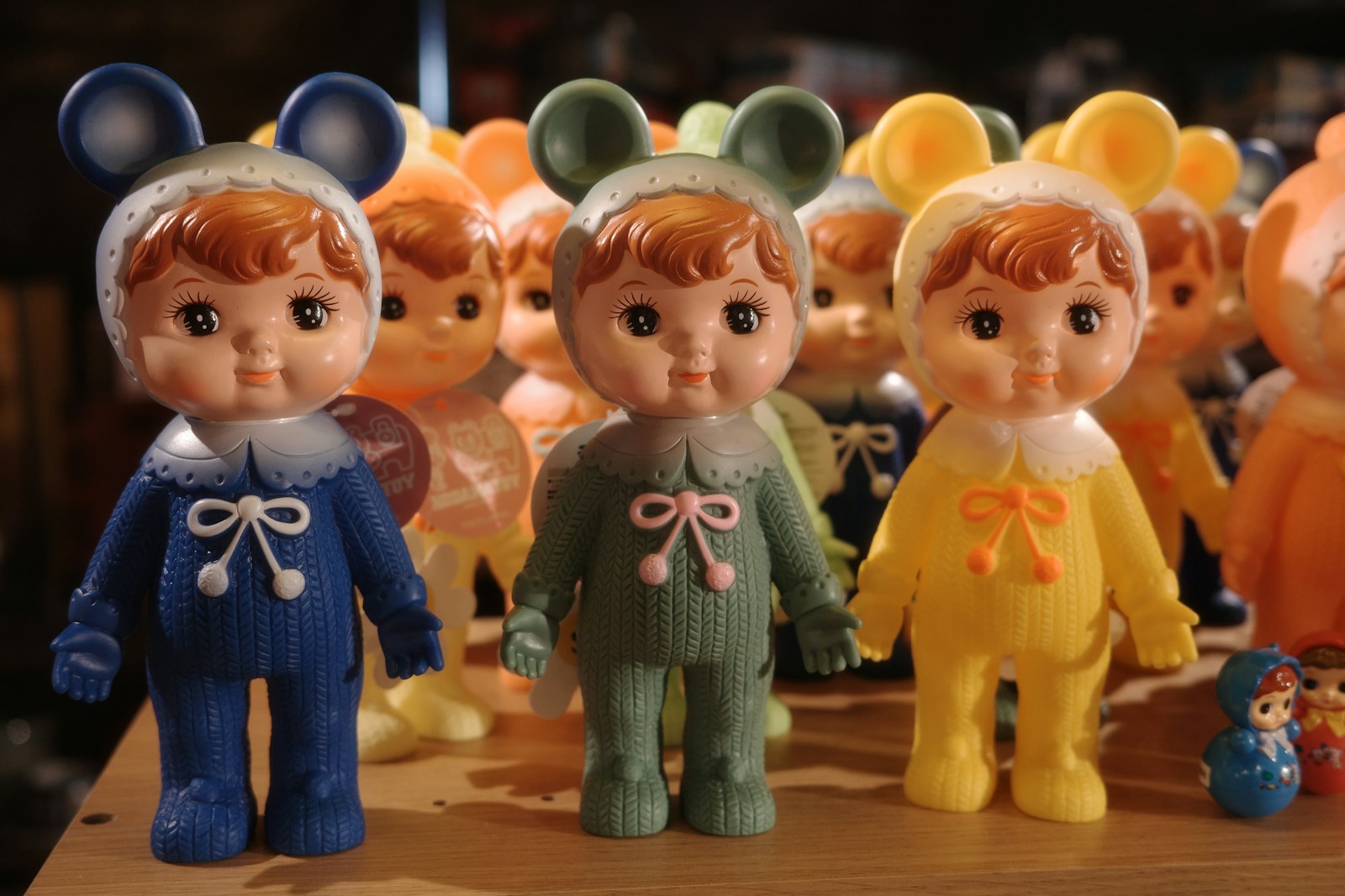Three vintage dolls wearing mouse costumes