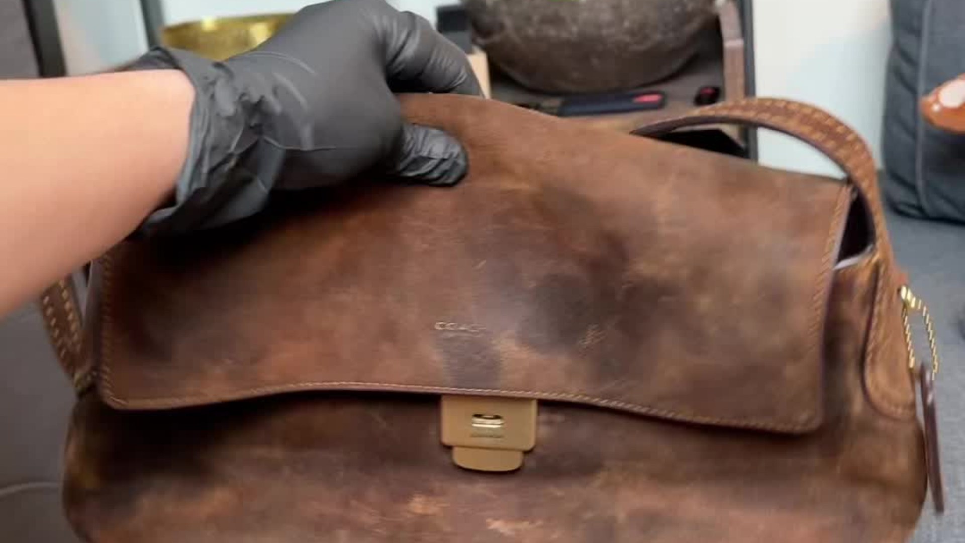 Stained suede Coach bag from Goodwill before restoration