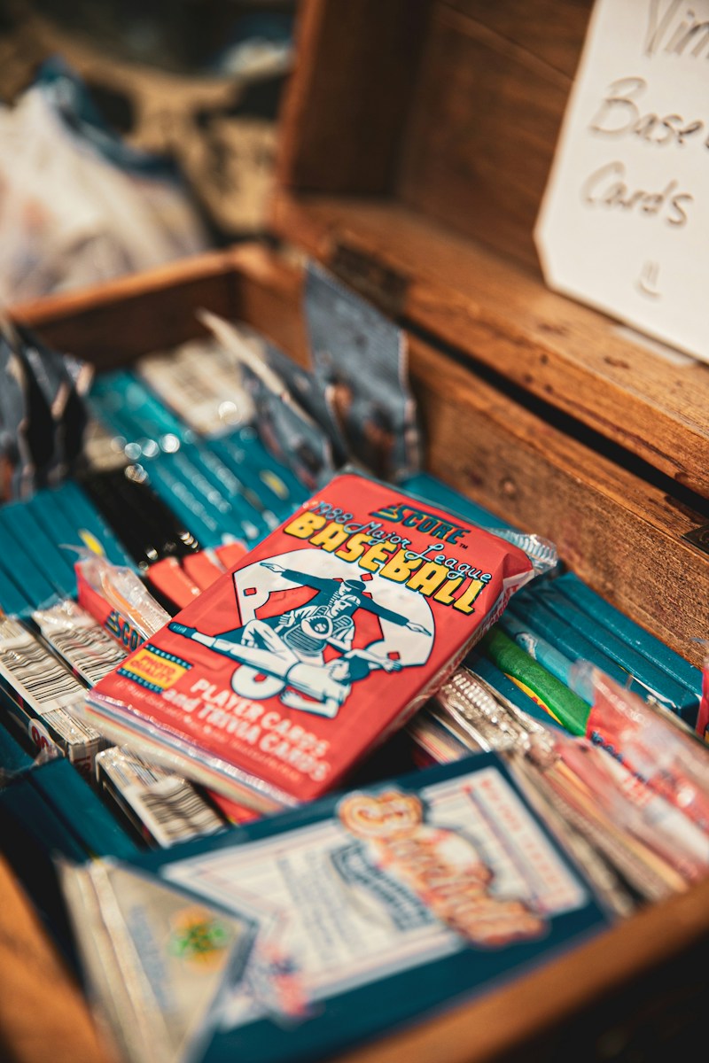 assorted books on brown wooden shelf