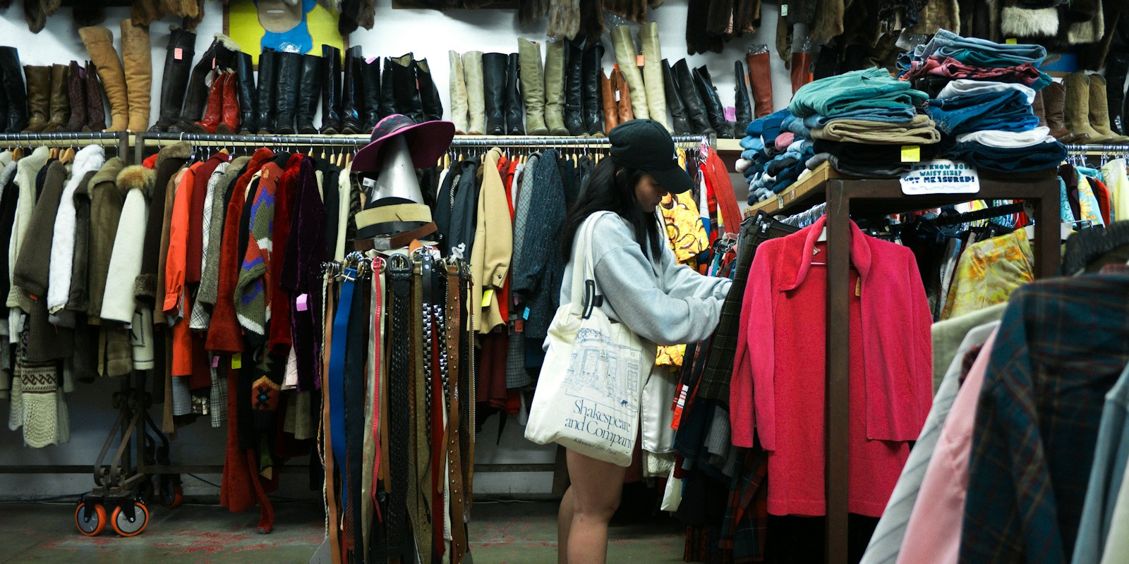 Woman browsing clothes at a thrift store