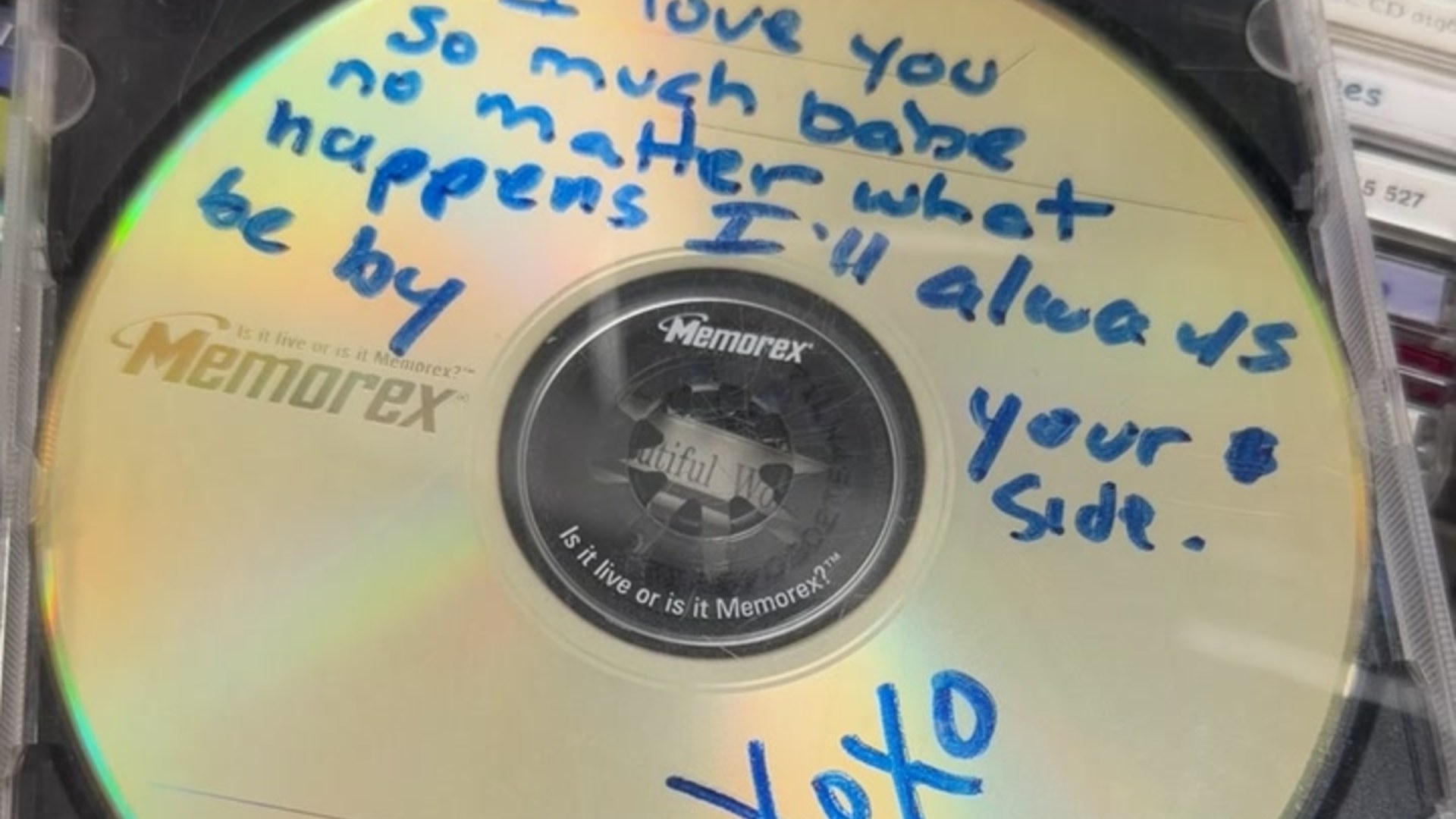 A Memorex CD-R found at a secondhand store with a handwritten message in blue marker ending in xoxo