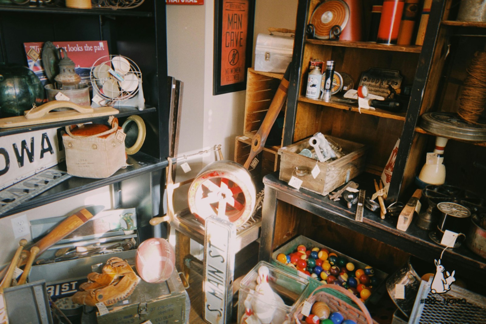Collection of vintage items on shelves and floor