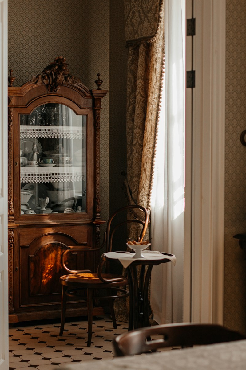 Antique cabinet with chair and small table