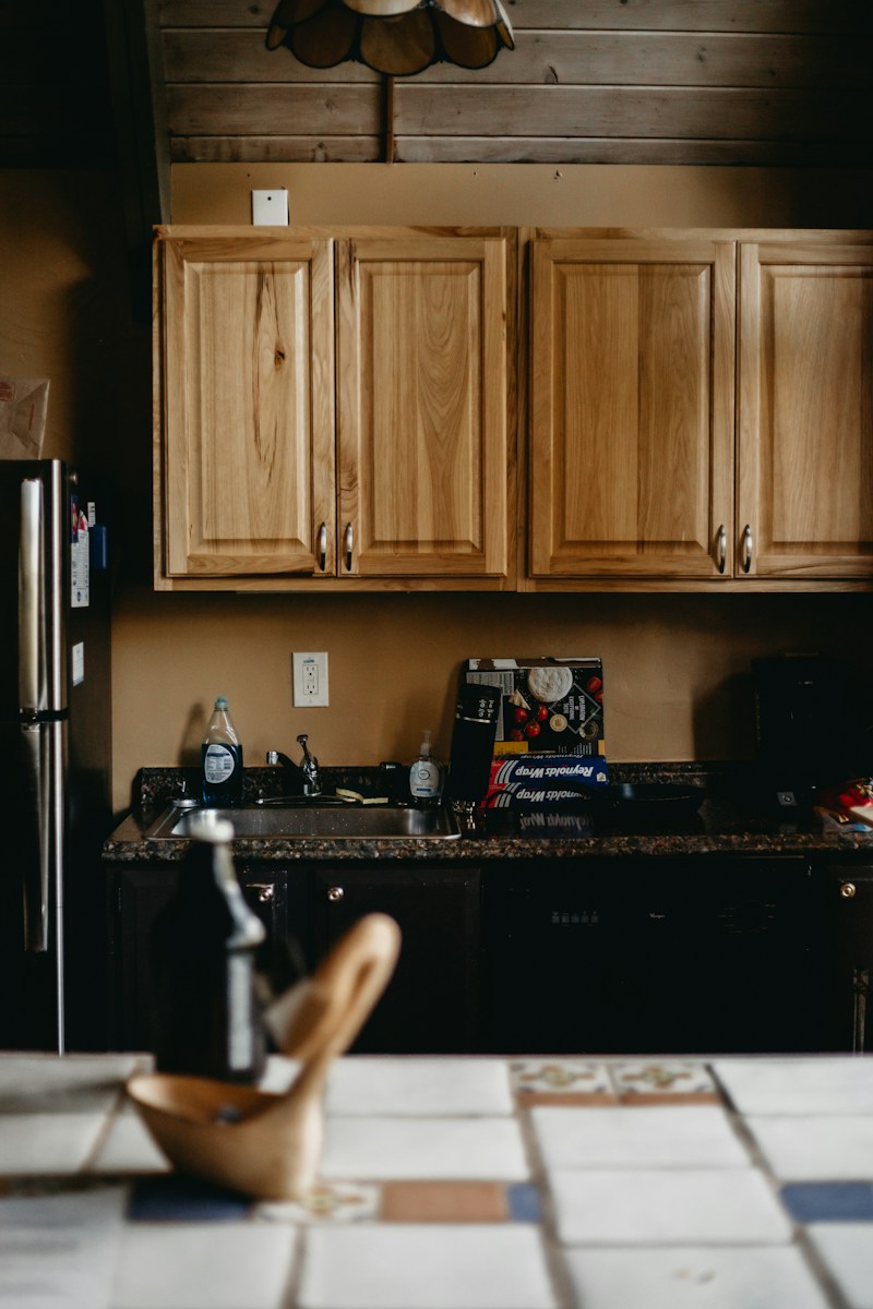 a kitchen with wooden cabinets