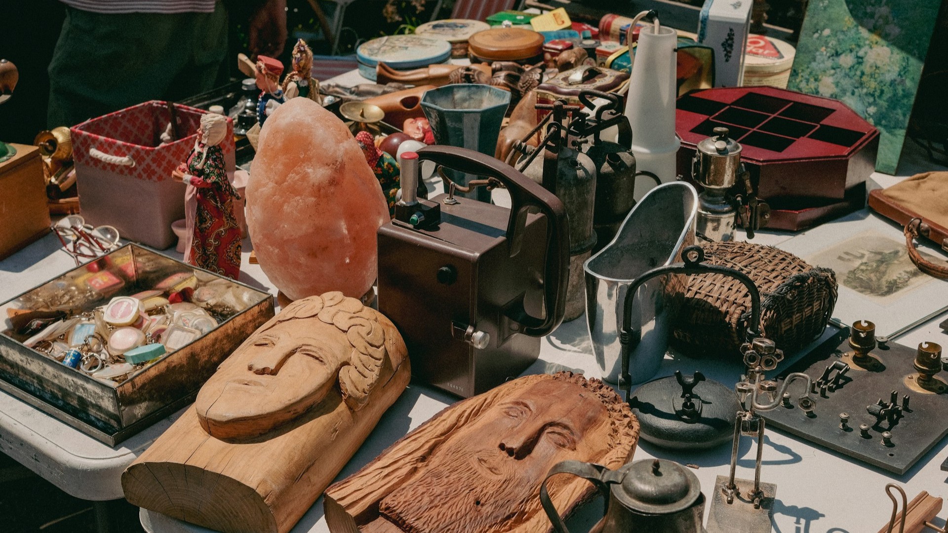 Unsplash photo by Dhiemas Afif Febriyan showing a table full of various items at a flea market