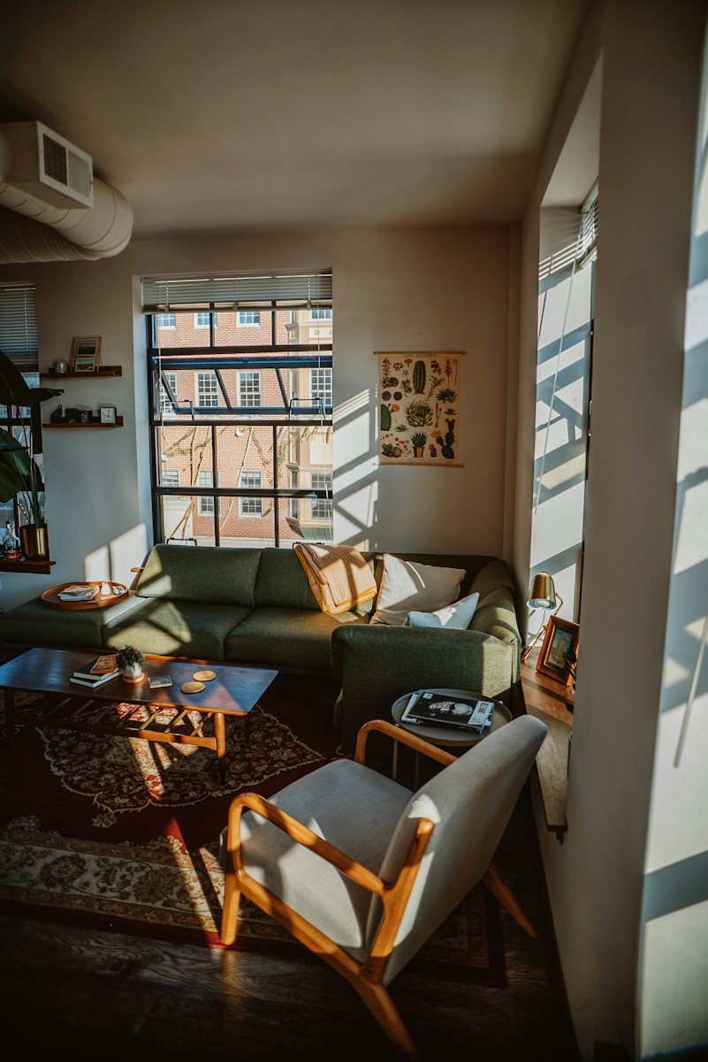 a living room with a couch and chairs
