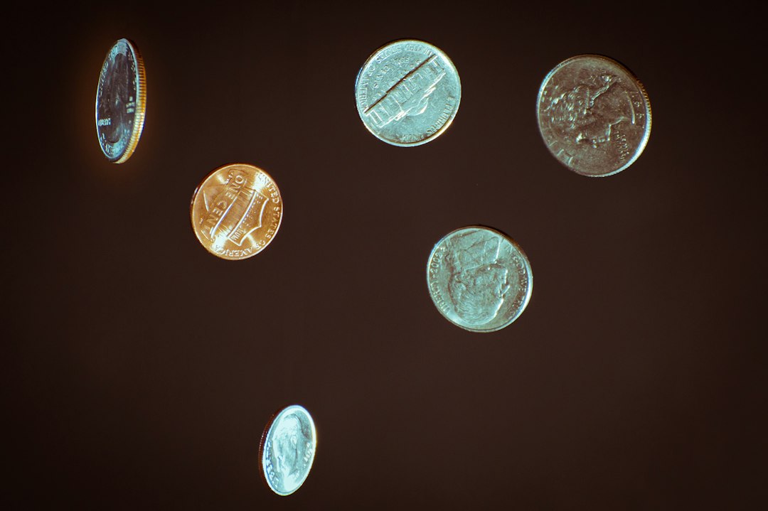 Rare old coins on a white surface