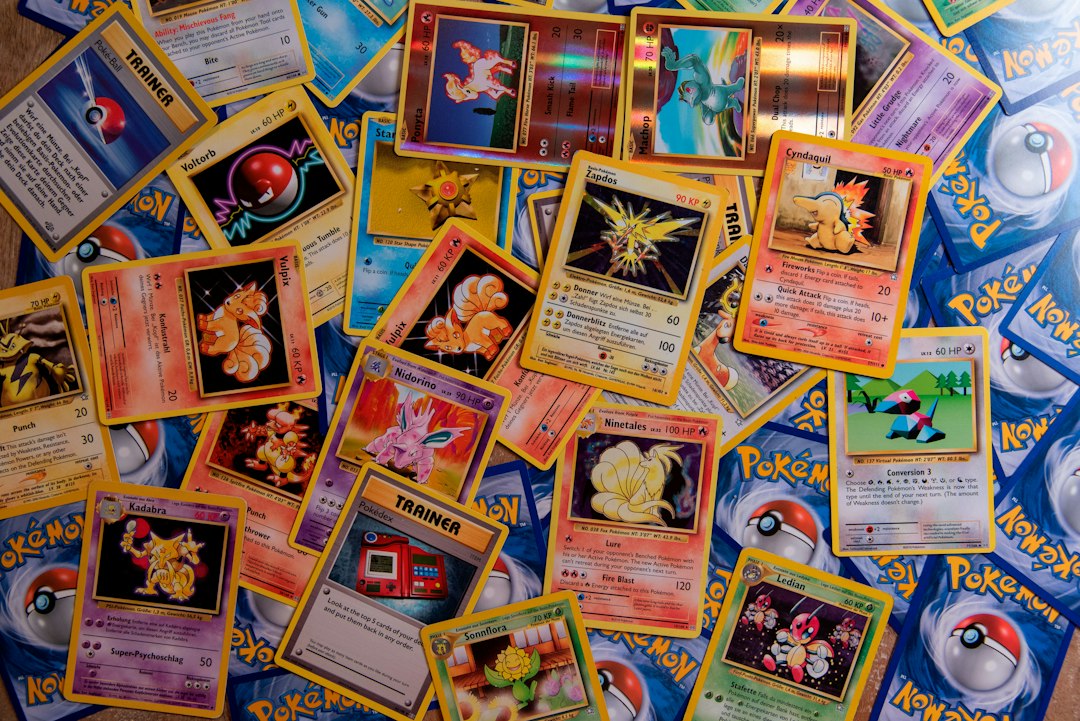 Colorful Pokemon trading cards scattered across a surface