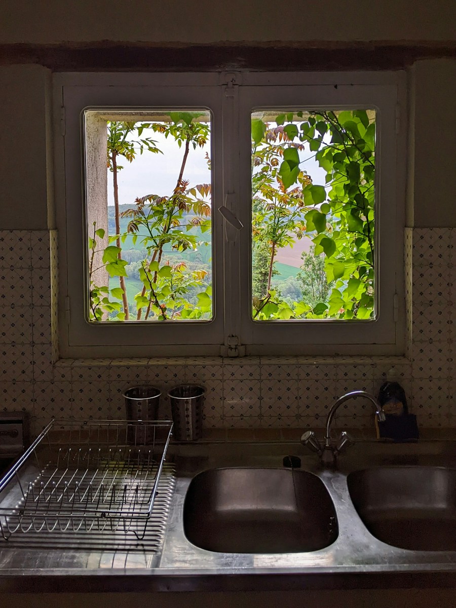 a kitchen with a double sink and a window